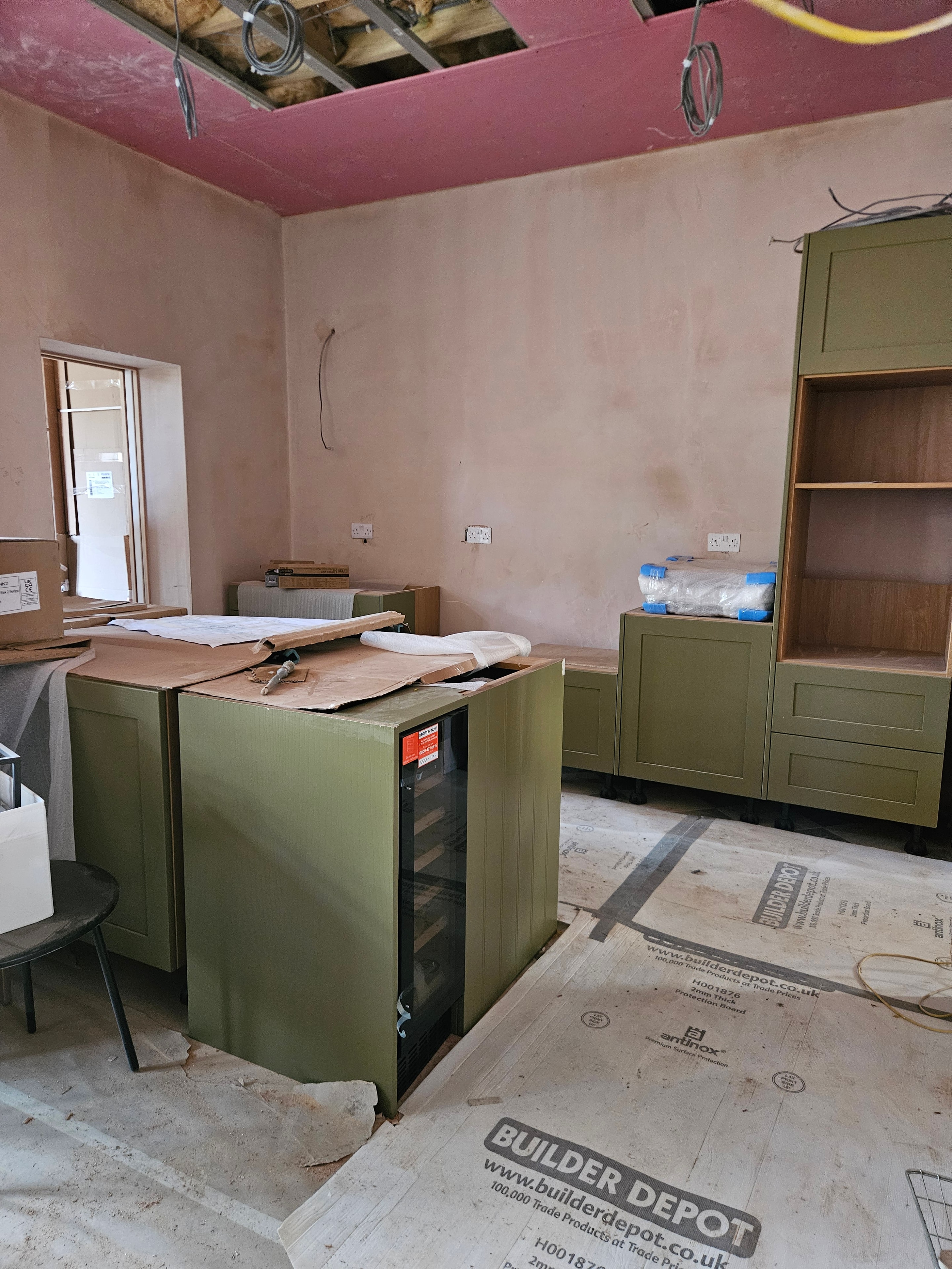 Cabinets progressing, island carcass taking shape